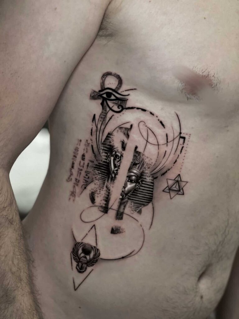 A man showing off a tattoo on his stomach, highlighting intricate designs and personal expression.