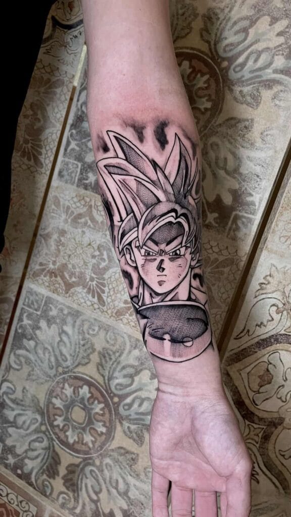 Dragon ball tattoo intricately designed on a forearm, showcasing detailed artwork.