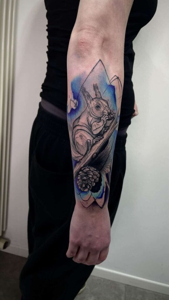A detailed tattoo of a cat inked on a person's arm, showcasing intricate designs and vibrant colors.