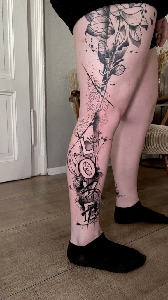 A woman showcasing her leg tattoos, highlighting intricate designs and vibrant colors against her skin.