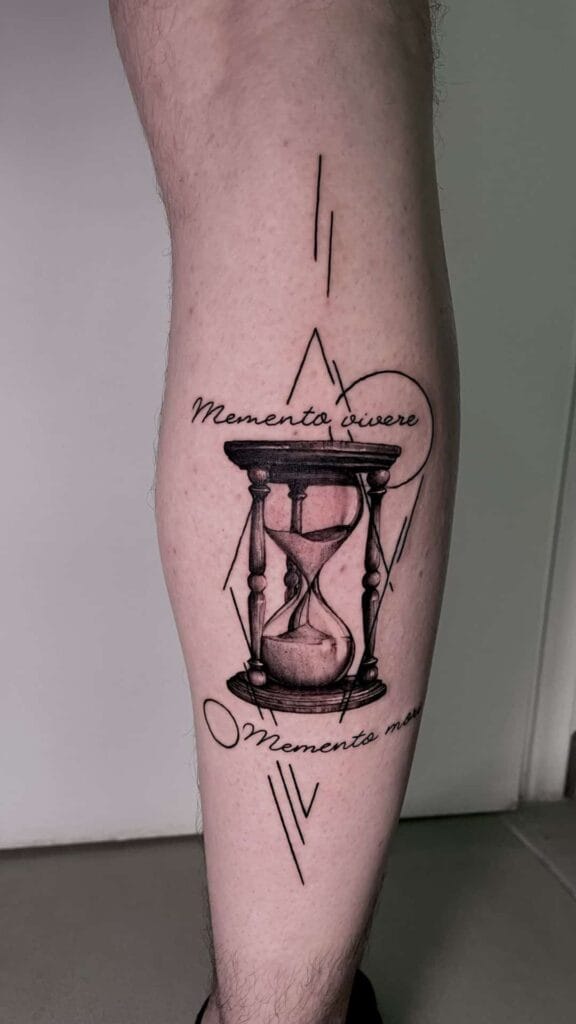 A detailed tattoo of an hourglass inked on a leg, symbolizing the passage of time and life's fleeting moments.